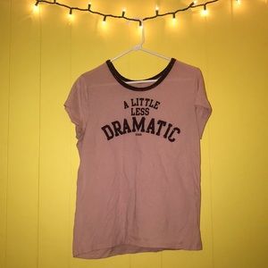 It is a mauve pink shirt with velvet trimming.